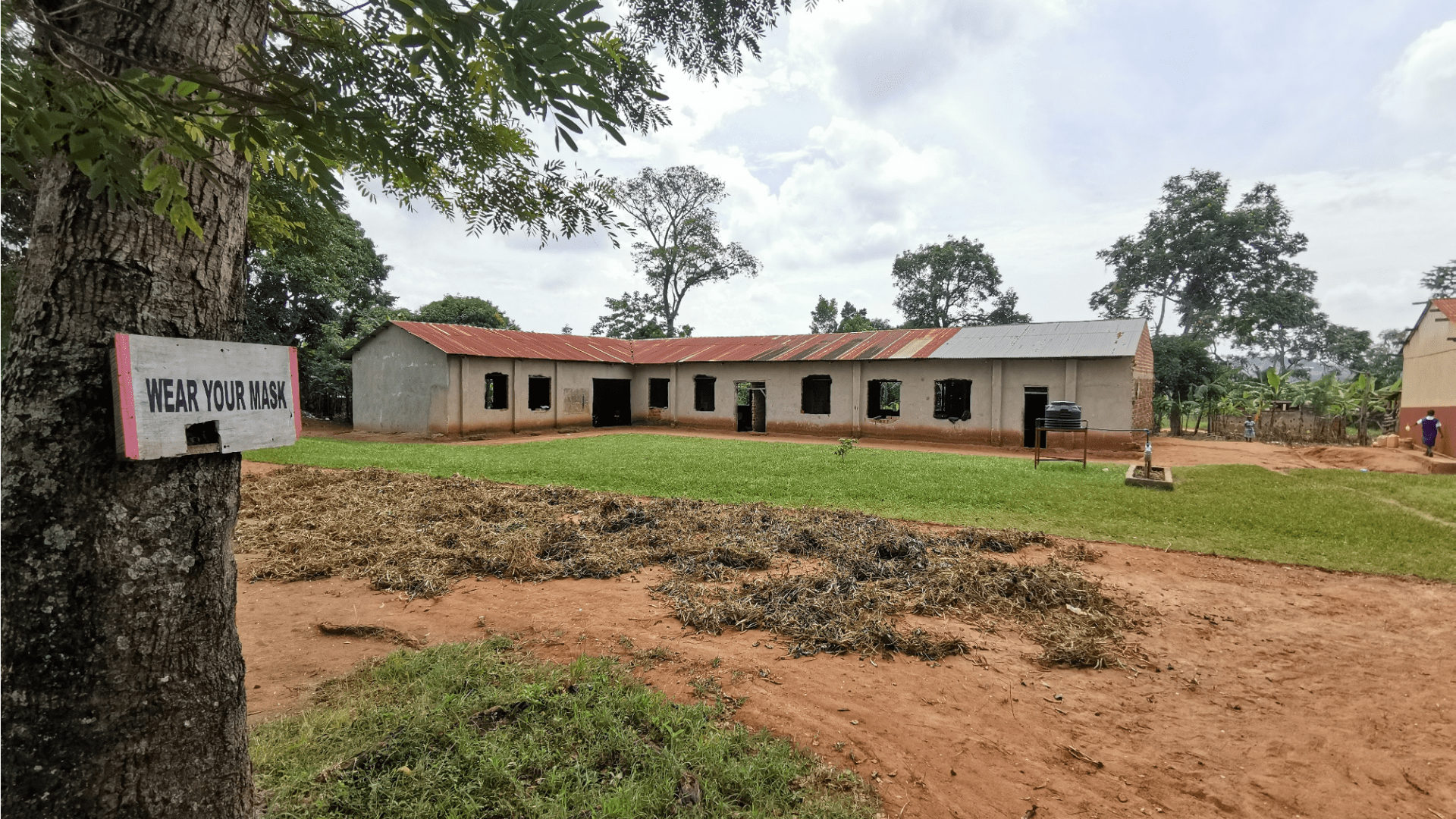 die Darstellung eines Schulgebäudes in Uganda